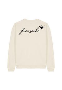 Felpa crema con maniche lunghe e collo rotondo. Testo ricamato in nero "free soul" e un design di un uccello sul retro. Tessuto morbido.