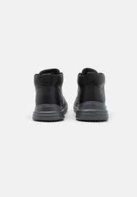Skechers PROVEN - Botines con cordones - black