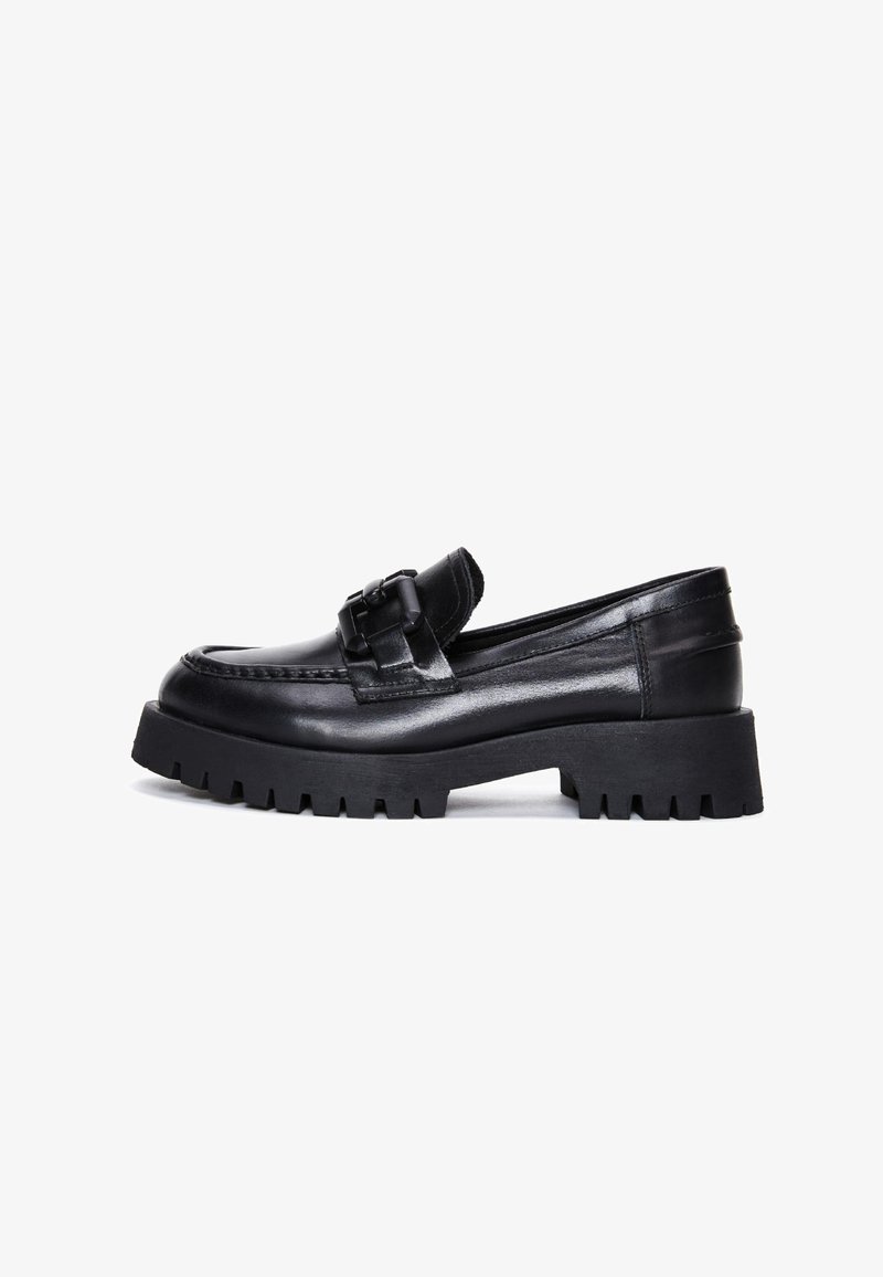 Black leather loafer with a chunky rubber sole and textured strap detail. Features a round toe and low heel. Smooth and glossy finish.