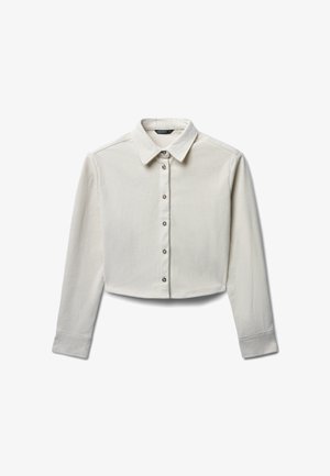 Gepolsterte Hemdbluse aus leichtem cremefarbenem Rippstoff, mit einem spitzen Kragen und fünf vorderen Knöpfen. Lange Ärmel mit Manschettendetail.