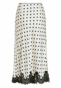 Jupe en satin blanc à pois noirs, avec un bord en dentelle noire le long de l'ourlet. Coupe trapèze avec une texture lisse et des détails à la taille.