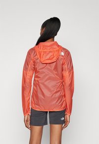 The North Face SHELL - Windbreakers - radiant orange/black