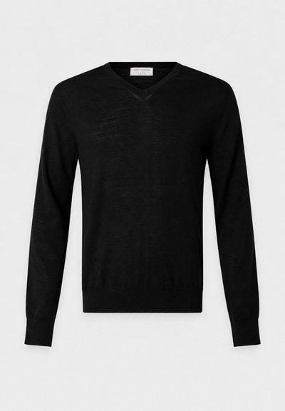 Pull léger noir à manches longues avec col en V, poignets et ourlet côtelés, présenté sur un fond clair uni.