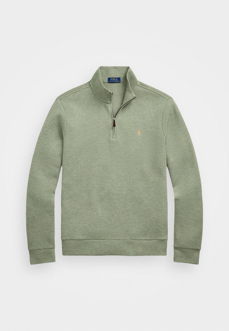 Lysegrønn genser laget av mykt stoff, med halvlange glidelås og en liten, brodert logo på brystet.