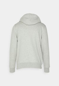 Felpa grigia con cappuccio, maniche lunghe, polsini e fondo a coste. Realizzata in un morbido tessuto testurizzato. La vista posteriore mostra dettagli delle cuciture lisce.