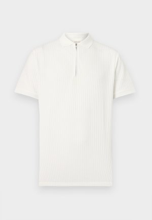 Biela krátky rukáv polo košeľa s vertikálnym rebrovaním a predným zipsom od goliera po stred hrudníka.