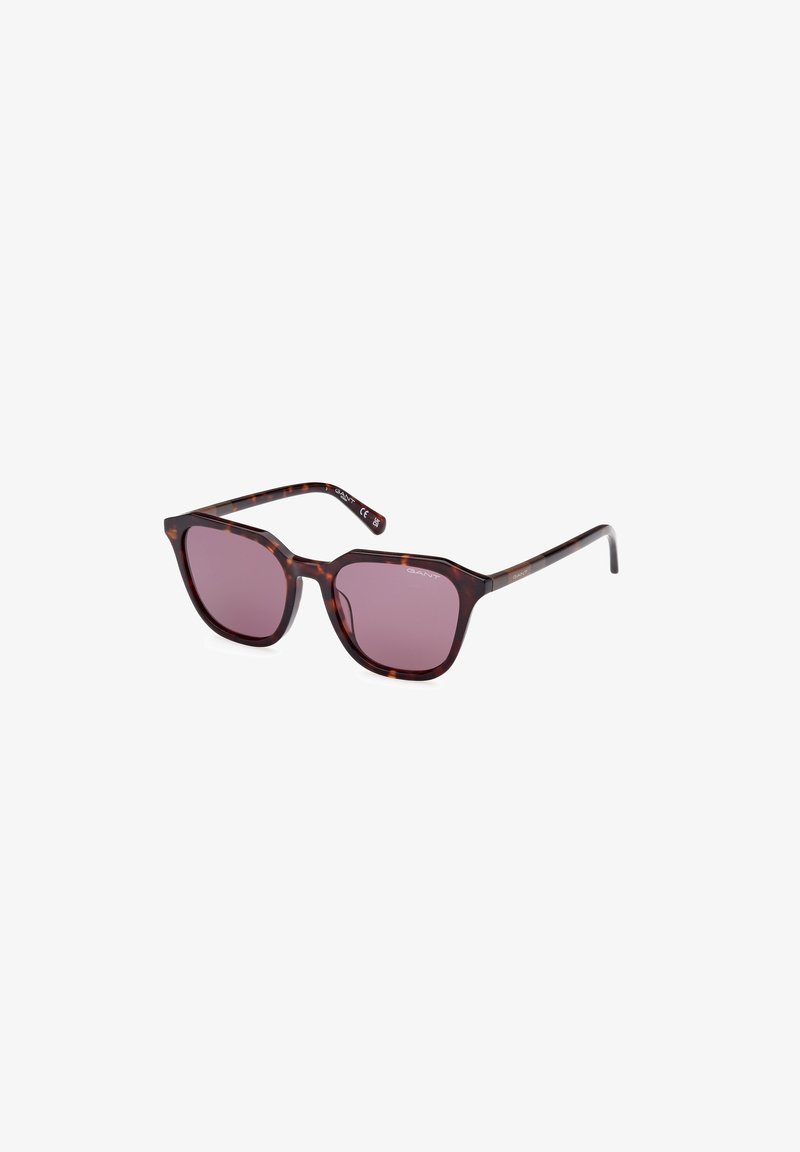 Ochelari de soare tortoise brown cu o ramă pătrată, lentile violet și brațe subțiri, având un branding subtil pe templul stâng.
