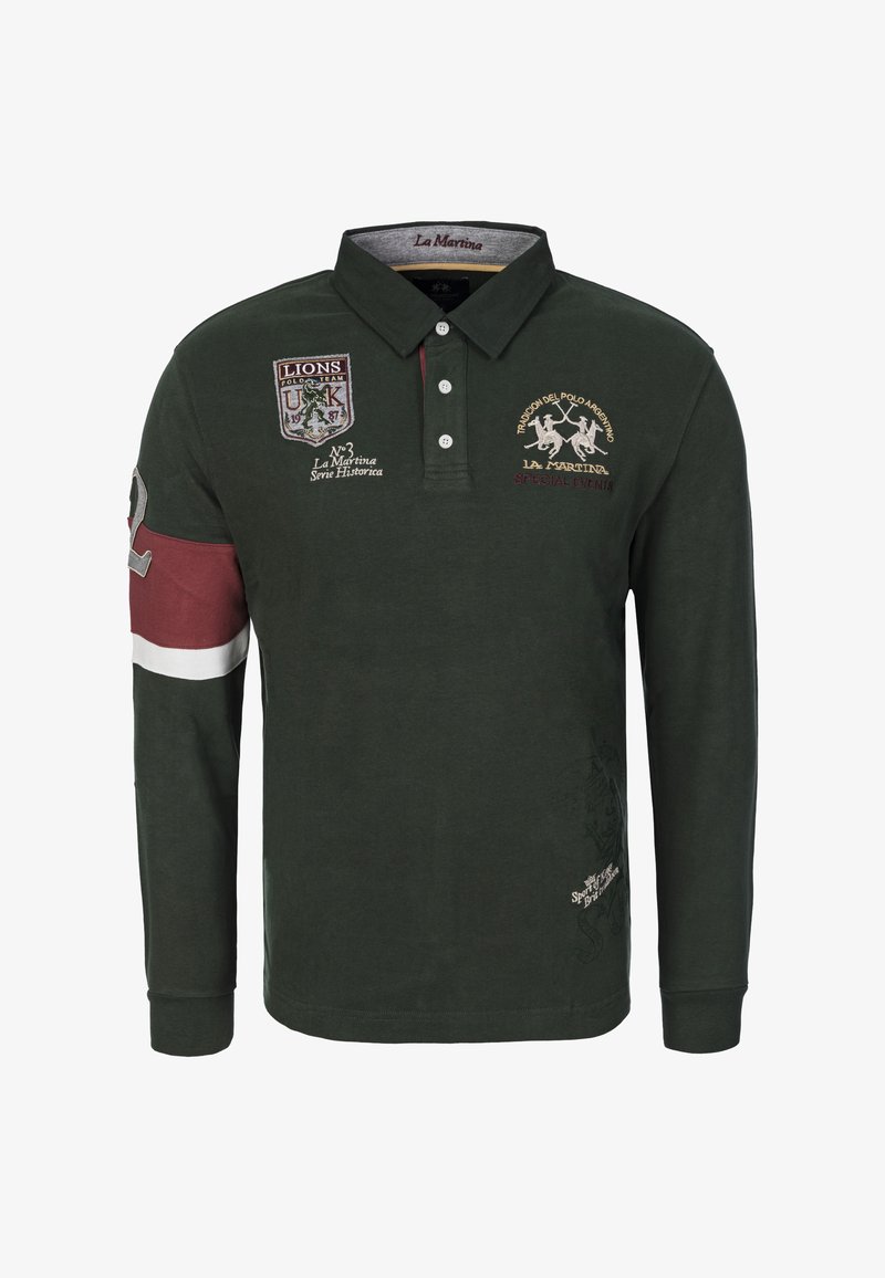 Tummanvihreä pitkähihainen poolopaita, jossa kirjailut ja vahvistettu kaulus sekä viininpunaiset yksityiskohdat vasemmassa hihassa. Materiaalina puuvilla.