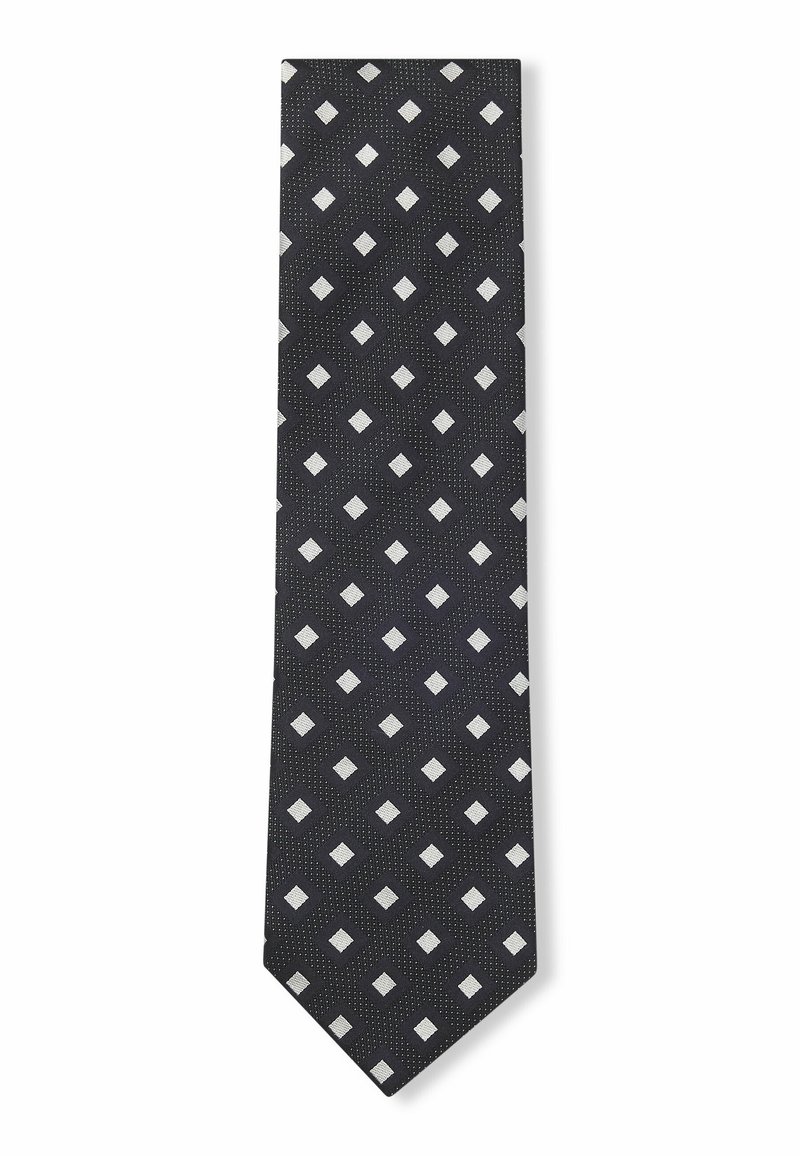 Svart slips med ett diamantmönster i silver, med strukturerad yta och subtila prickar. Smal form med spetsig topp.