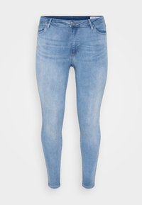 Light blue denim skinny jeans with a smooth texture, five-pocket design, and metal button closure. Fitted through legs and ankle.