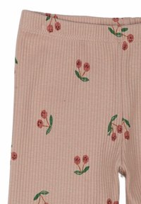 Leggings ribbekas i mjuk rosa tyg prydda med ett blommönster som har röda bär och gröna blad. Elastisk midjeband.