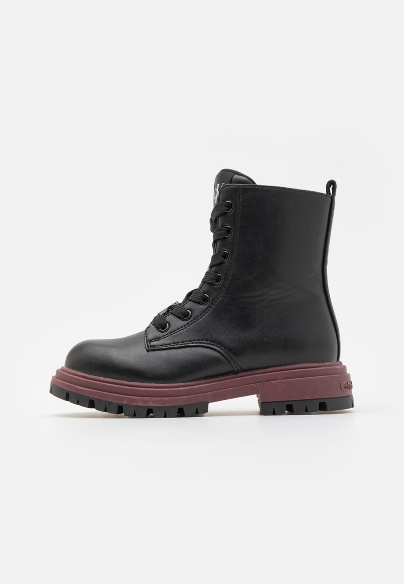 Black leather ankle boot with a rounded toe, lace-up front, and contrasting burgundy rubber sole. Features a pull tab at the back.