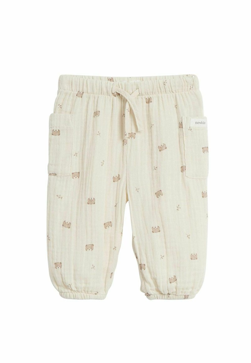 Leichte, cremefarbene Baumwollhose mit einem subtilen Bärenmuster, elastischem Bund und zwei seitlichen Taschen mit Rippstruktur.