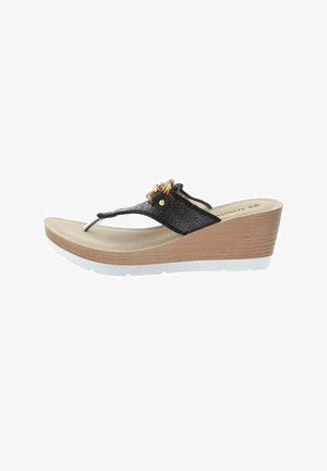 Sandale compensée marron avec bride noire texturée en forme de tongs et perles décoratives sur le dessus, avec une semelle blanche en caoutchouc.