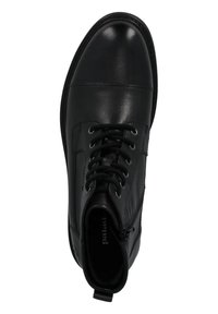 Stivale alla caviglia in pelle nera con punta rotonda, design con lacci e cerniera laterale. Tessuto liscio con dettagli di cucitura discreti e tacco arrotondato.