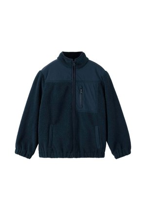 Veste polaire bleu marine foncé avec col montant, fermeture éclair sur toute la longueur à l’avant, poche poitrine zippée et deux poches latérales.