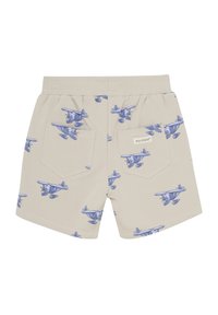 Beige shorts med ett tryckt mönster av blå plan, elastisk midja och två bakfickor med en etikett.