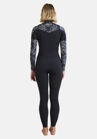 Wetsuit featuring a predominantly black body with floral patterned sleeves. Made of stretchy material, it has a streamlined design and seamless construction.