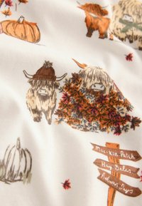 Cute highland cows with autumn leaves, pumpkins, and wooden signposts on white fabric with fall-themed design.