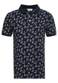 Polo à manches courtes bleu marine avec un motif floral blanc et un col et des poignets solides.