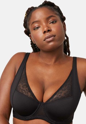 Sujetador negro con un inserto de encaje. Presenta una forma de copa triangular, tejido liso, tirantes ajustables y costuras decorativas a lo largo de los bordes.