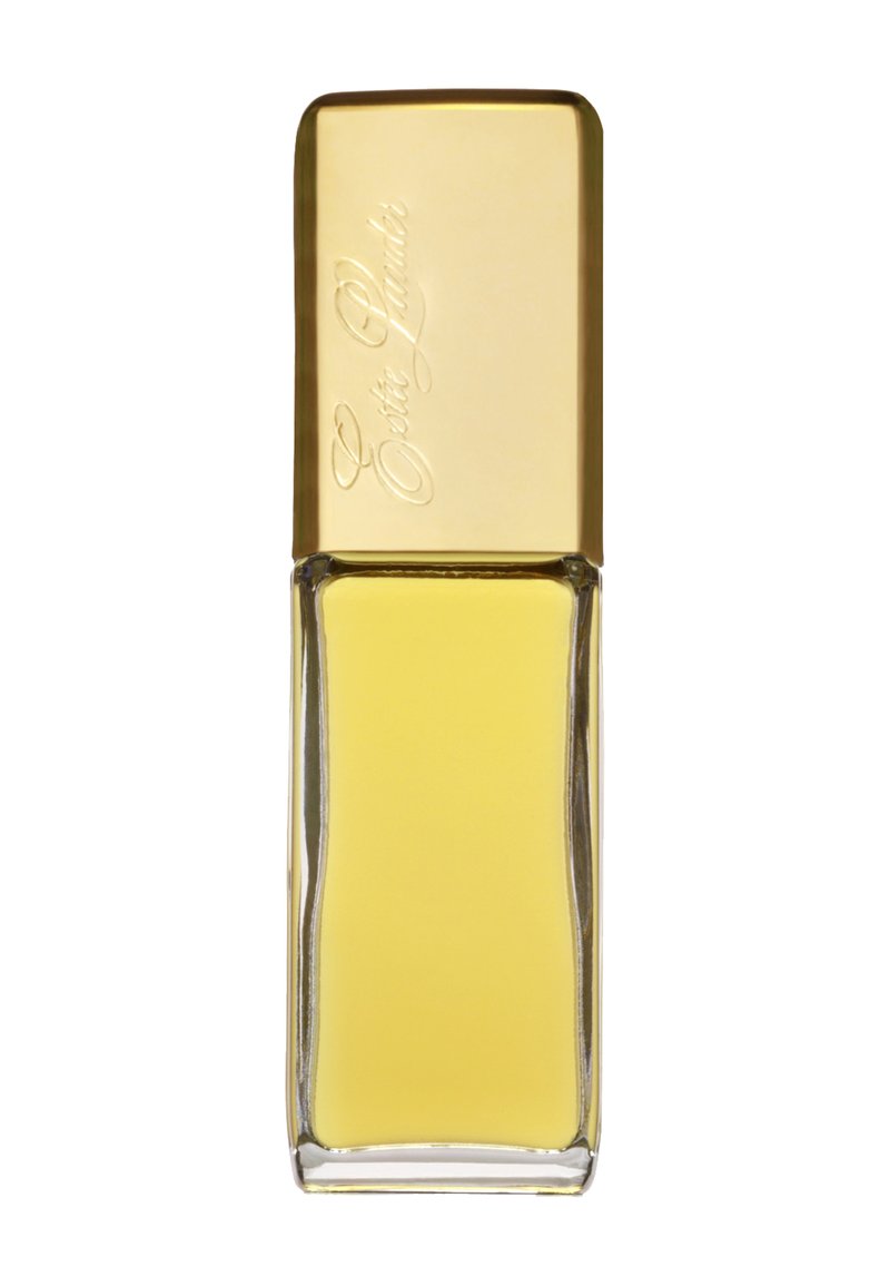 Bouteille de parfum en verre jaune, de forme rectangulaire, dotée d'un couvercle en or gravé du nom de la marque. La base transparente met en valeur le liquide à l'intérieur.