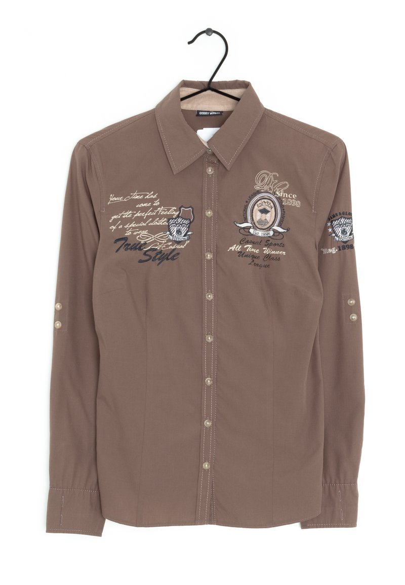 Chemise marron à manches longues avec un col à boutons. Présente des accents brodés et des détails de boutons sur les poignets. Texture lisse, coupe ajustée.