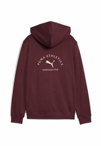 Burgunderfarbener Kapuzenpullover mit einem weißen "PUMA ATHLETICS"-Logo und einer Puma-Grafik, unter dem Logo steht der Text "gegründet 1948".