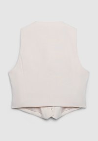 Veste sans manches couleur crème clair avec une silhouette ajustée, une texture lisse et un dos avec un détail plié. Design sur mesure, sans éléments métalliques visibles.