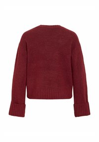 Villane burgundia tooniga kampsun, lühendatud lõige, laiad varrukad, soonikkäised ja -ääris. Pehme tekstuur ja veidi lõdvaltist istuvus.