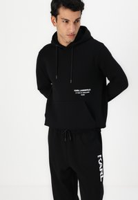 KARL LAGERFELD PANTS - Donji dijelovi trenirke - black