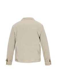 Beige bomuldsjakke med krave, lange ærmer og sideslids ved manchetterne. Glat tekstur og et enkelt, klassisk design.