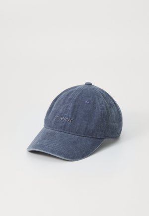 Navy blue cotton baseball cap with a curved brim, embroidered logo on the front, and adjustable back strap. Soft, textured fabric.