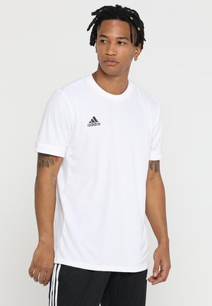 T-shirt atletica bianca realizzata in tessuto leggero, con colletto rotondo e maniche corte, con il logo nero Adidas sul petto.