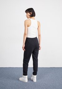 Nike Sportswear Tracksuit bottoms - black
