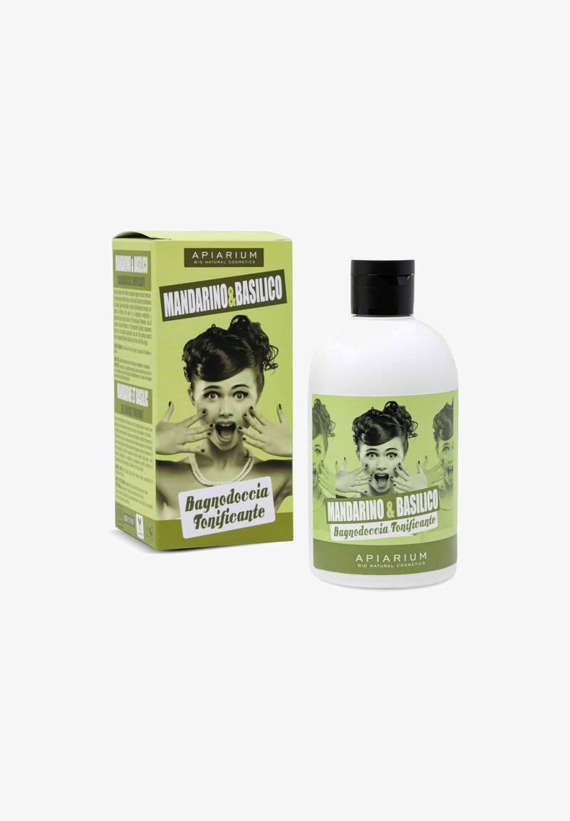 Bottiglia bianca con tappo nero, etichettata "Mandarino & Basilico, Bagnodoccia Tonificante." La scatola verde presenta un design grafico in stile vintage.