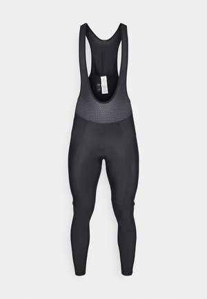 Zwarte fietsbibshorts met een gestructureerd bovenpaneel met een mesh ontwerp, aansluitende benen en een gevoerde zit voor comfort.