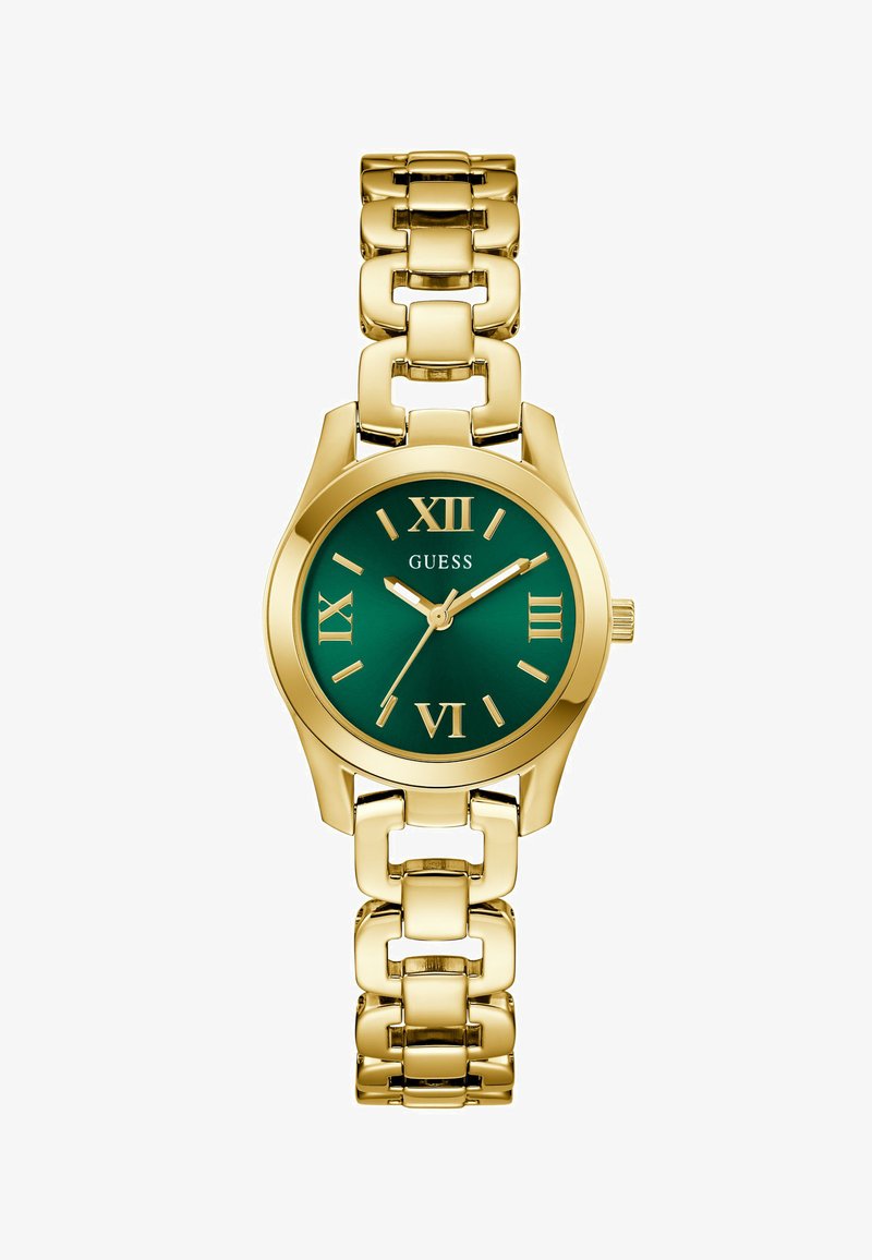 Gold metal wristwatch with linked band, green dial, Roman numerals, and three hands showing 10:09:36, brand name Guess on the face.
