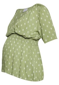Blusa maternità verde con motivo a foglie bianche, maniche corte, scollo a V e vita elastica arricciata.