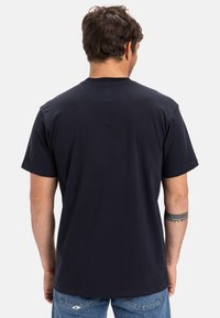 Dark navy short-sleeve t-shirt, crew neck, made of soft cotton. Plain design with no patterns or logos. Light texture, casual fit.