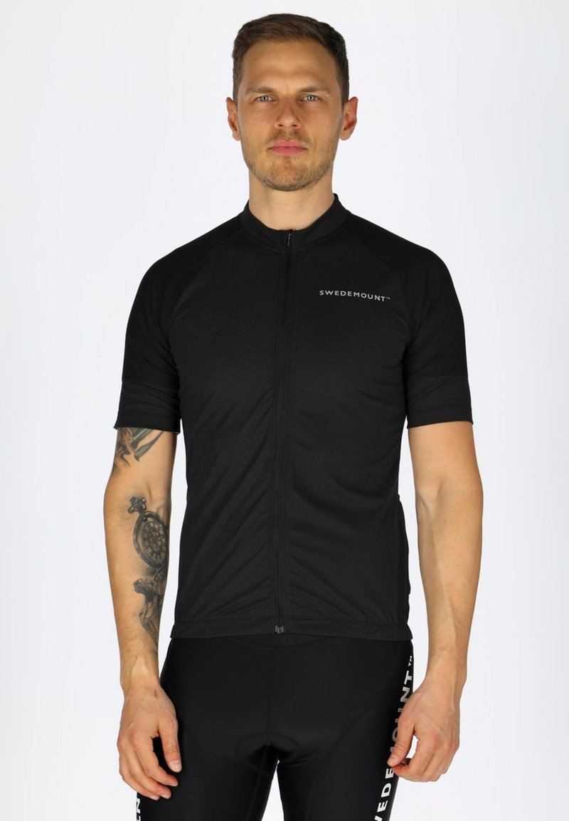 Schwarzes Radtrikot mit kurzen Ärmeln, ausgestattet mit einem Reißverschluss auf der Vorderseite und reflektierenden Logodetails. Das Material wirkt leicht und strukturiert.