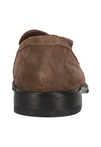 Brown suede loafers with a smooth black rubber sole, featuring a rounded shape and minimal stitching details on the upper.