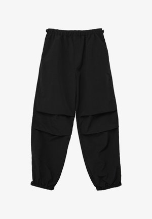 Schwarze, locker sitzende Hose mit elastischem Bund und gerafften Bündchen. Verfügt über geschichtete Fronttaschen und eine glatte Stofftextur.