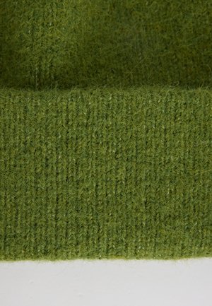 Tessuto di lana verde a maglia con un motivo testurizzato a coste. Il materiale appare morbido e leggermente peloso, con sottili variazioni di tonalità.