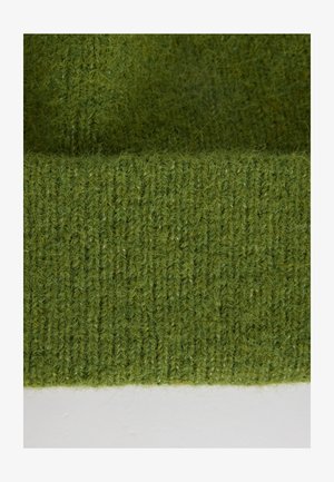 Tessuto di lana verde a maglia con un motivo testurizzato a coste. Il materiale appare morbido e leggermente peloso, con sottili variazioni di tonalità.