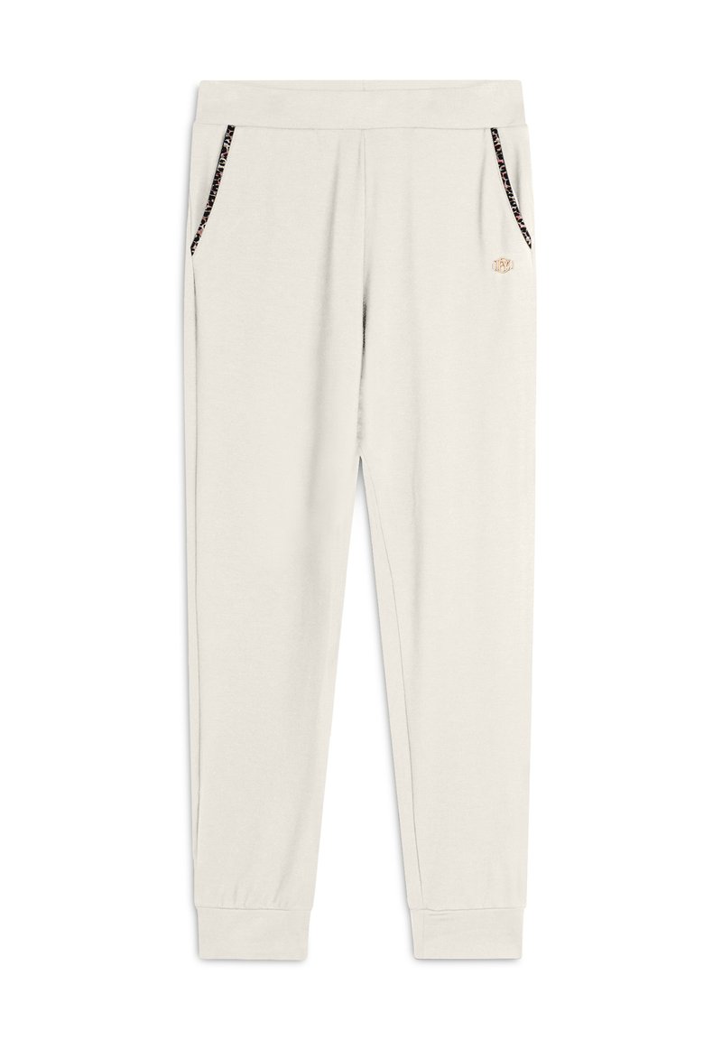 Pantalones de chándal beige claro hechos de tela suave, con bolsillos laterales con bordes en negro y dorado y puños ajustados en los tobillos.