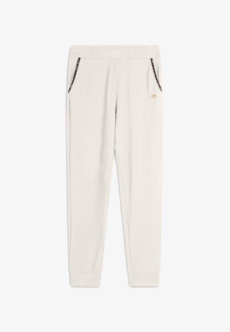 Pantalones de chándal beige claro hechos de tela suave, con bolsillos laterales con bordes en negro y dorado y puños ajustados en los tobillos.