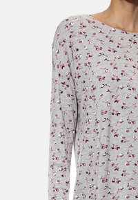 Gray long-sleeve shirt featuring a floral pattern in red, white, and brown. Made of soft, lightweight fabric with a relaxed fit.