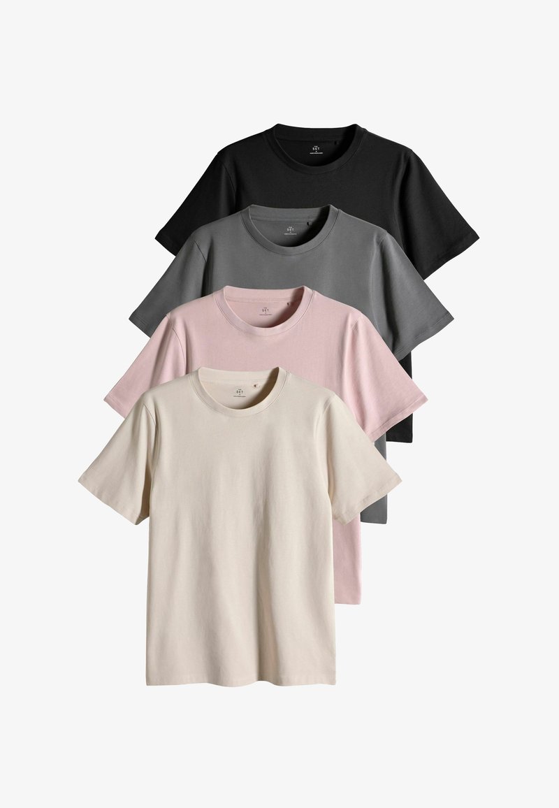 Cuatro camisetas de algodón apiladas: negra, gris oscuro, rosa claro y crudo. Cada una tiene cuello redondo y mangas cortas.