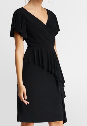 Black knee-length dress with flutter sleeves, V-neck, fitted waist, and asymmetrical ruffle detail cascading down one side.